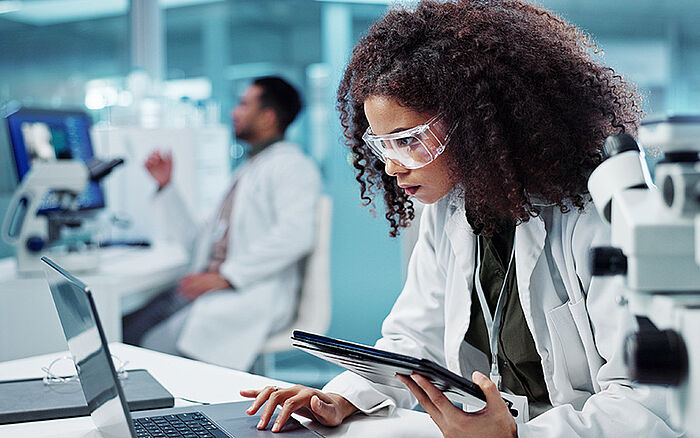 A researcher analyzes pharmaceutical data on a digital interface&mdash;advancing second medical use innovations through targeted compound repurposing.